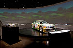 Blick in das BMW Museum mit seiner Art Car Ausstellung: Sandro Chia, Art Car, 1992 - BMW Renntourenwagen, 3er Reihe [vorne] und die dazu gehörige Marquette.