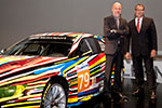 Dr. Ralf Rodepeter (Leiter BMW Museum) und Dr. Andreas Braun (Kurator der Ausstellung) vor Jeff Koons 17. BMW Art Car, 2010