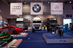 DTM-Ausstellung mit drei Teamtrucks von Audi, BMW und Mercedes 