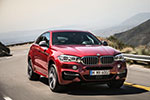 BMW X6 M50d in Flamenco Red